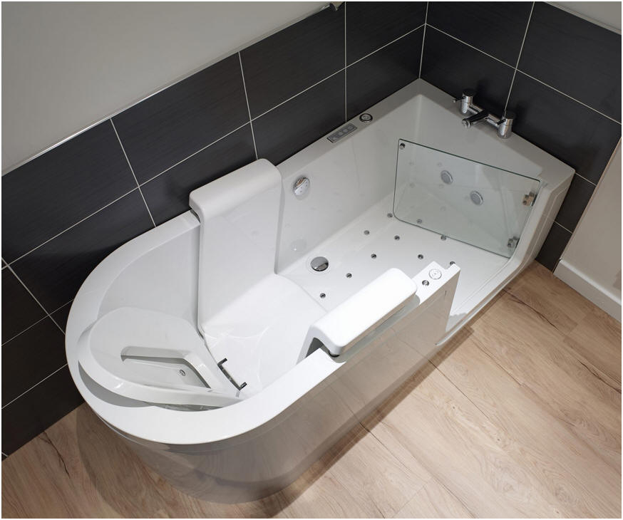 An overhead view of the Easy Riser Peninsula walk in bath showing the seat, assistive back support and warm air spa jets. Note the glass door and wide entrance with low step in height.