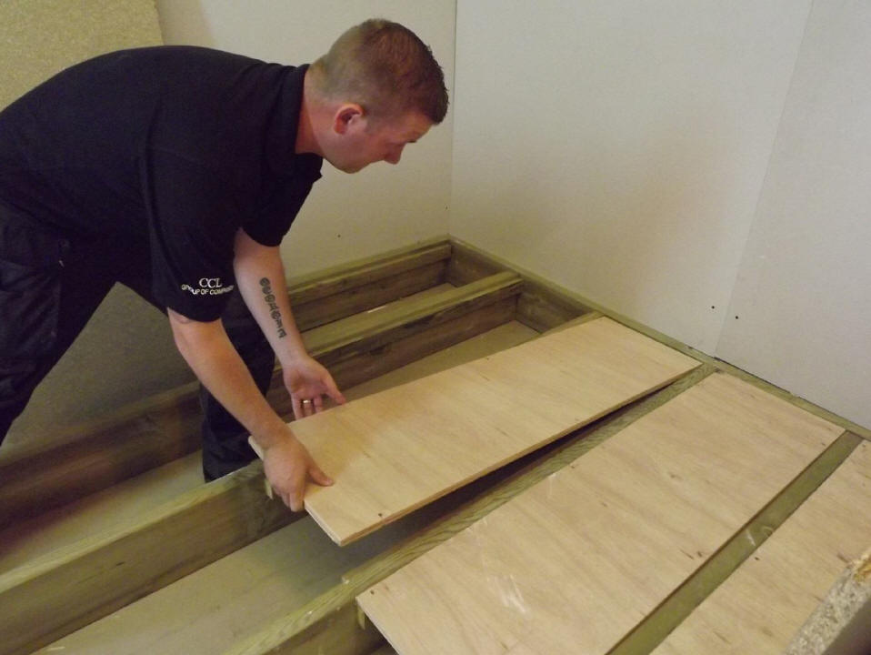 Cut plywood panels to fit between the joists. Sit them onto the battons.