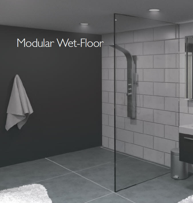 Modular system to create a floor in a wet room shower